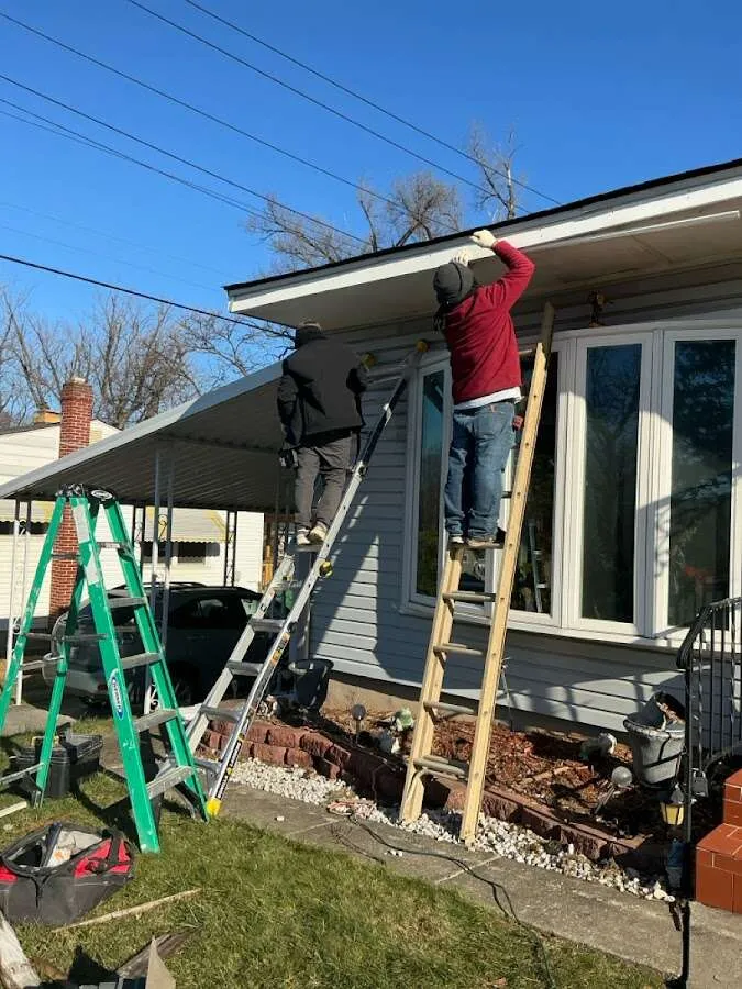 Restoration crew performing exterior repair in Slinger